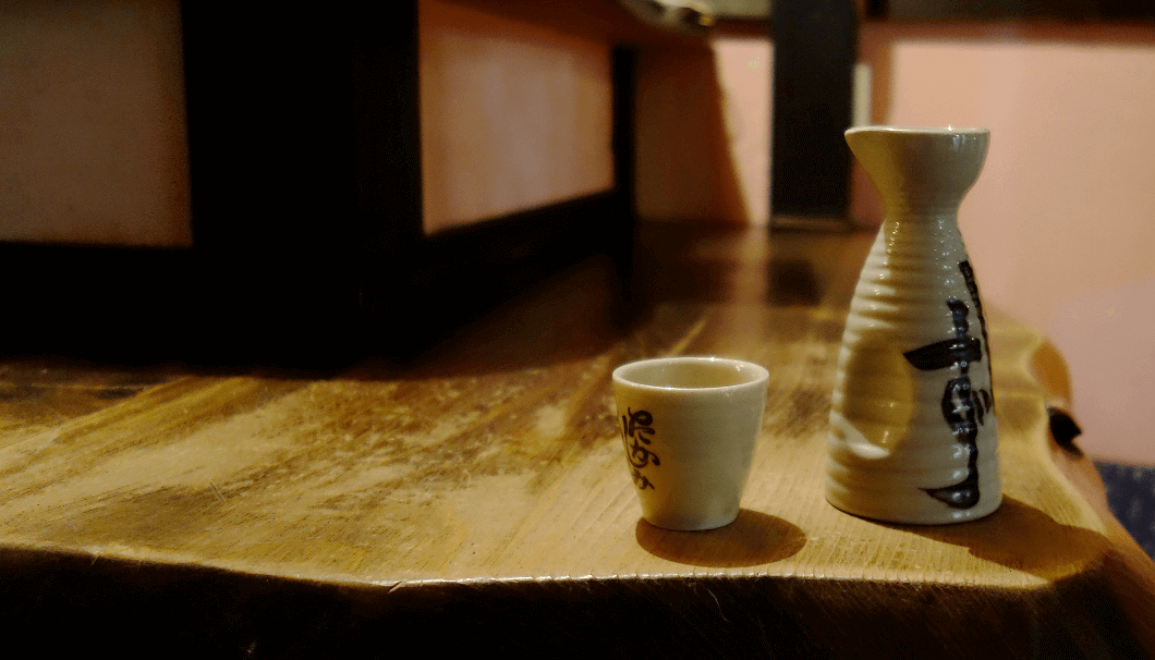 "tokkuri" carafe and "ochoko" cup holding sake