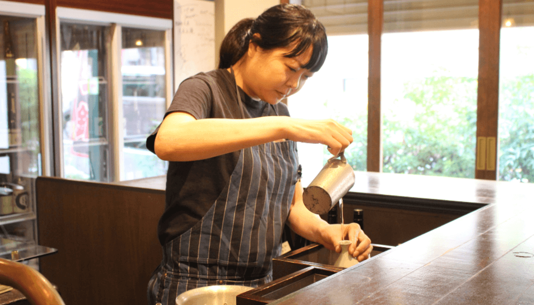 Marie Chiba is pouring sake to tokkuri for serving kanzake